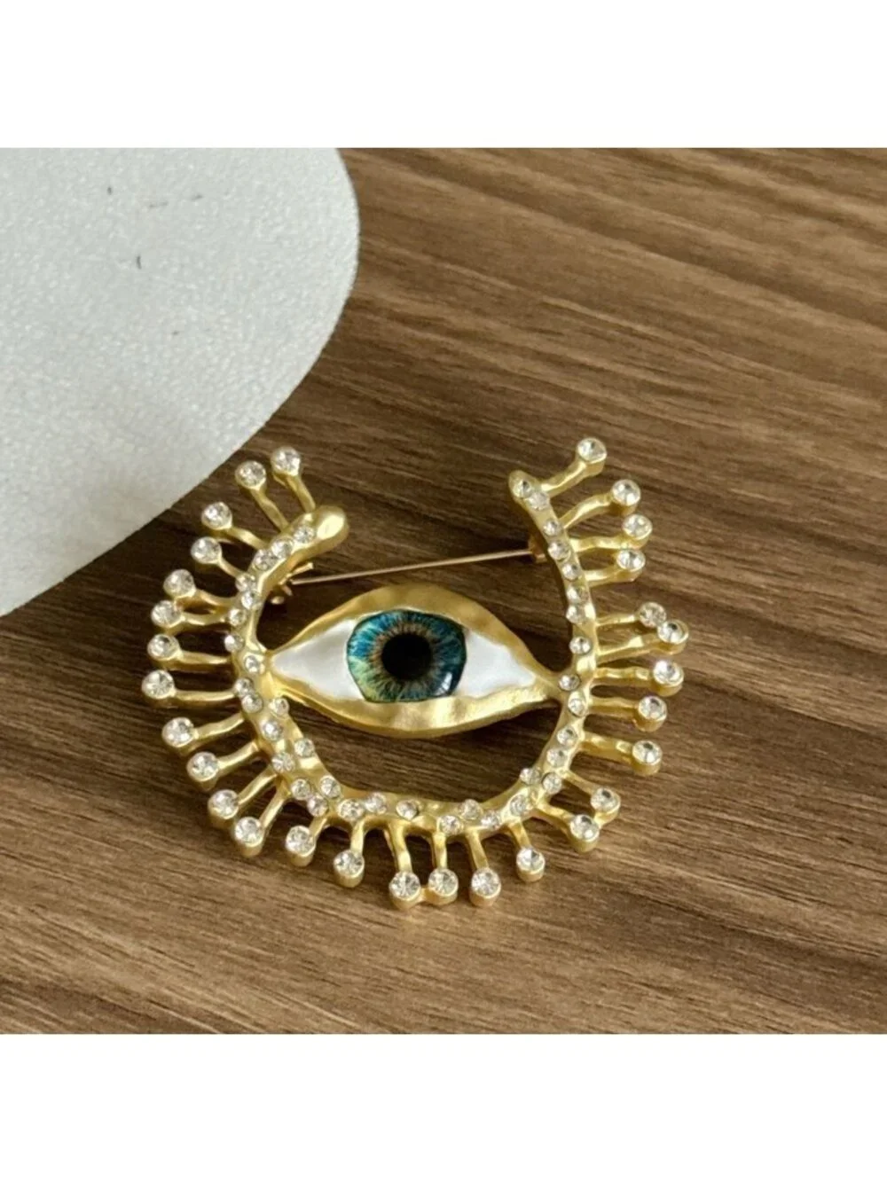 Gold Eye Brooch with Crystals Q674
